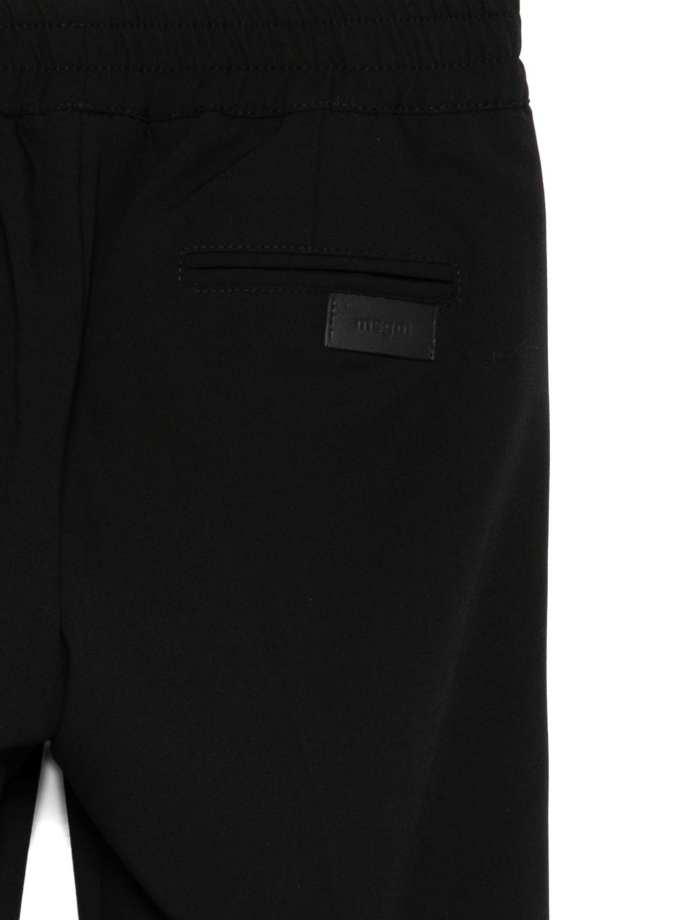 Pantaloni per bambini MSGM Kids neri con elastico in vita e orli svasati F5MSJUPA054 MS040 MSGM KIDS