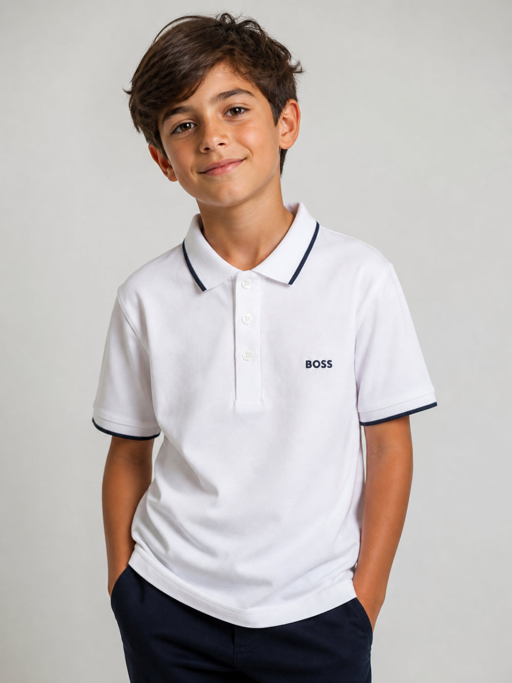 Polo per bambino Boss Kids bianca con logo goffrato J25P26 10P BOSS KIDS