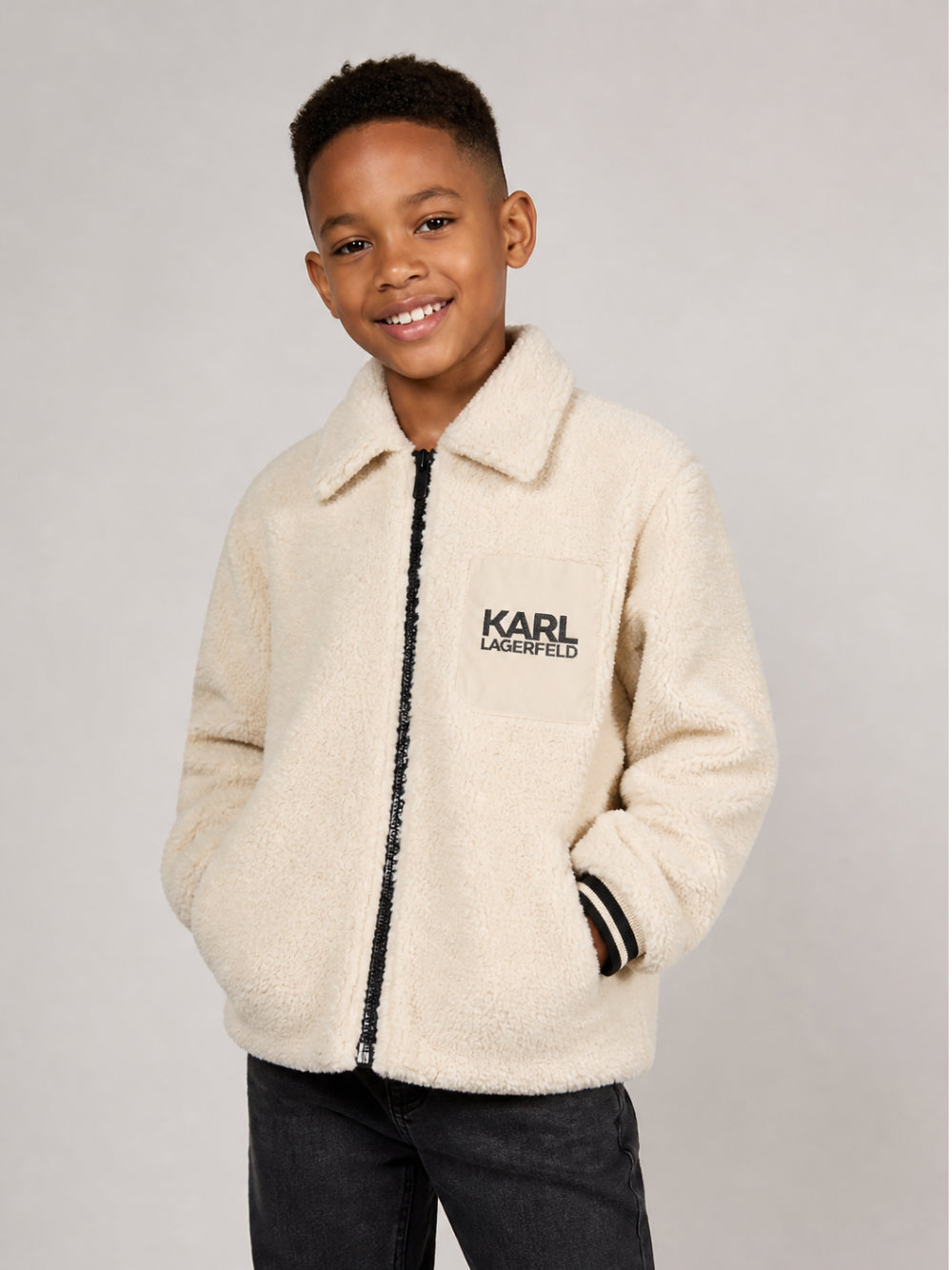 Giacca per bambino Karl Lagerfeld Kids crema in shearling sintetico con logo Z31392 184 KARL LAGERFELD KIDS