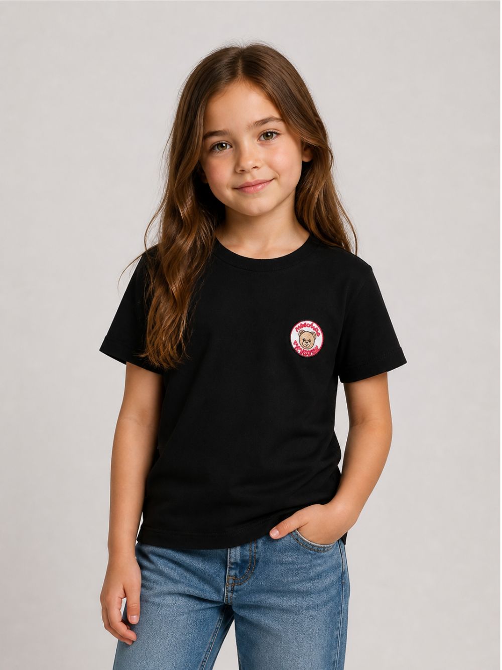 T-shirt per bambini Moschino Kids nera con Teddy Bear applicato sul petto H9M05GLAA59 60100 MOSCHINO KIDS
