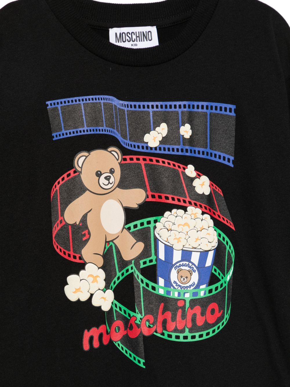 T-shirt per bambini Moschino Kids nera con stampa grafica sul davanti HPM05WLAA10 60100 MOSCHINO KIDS