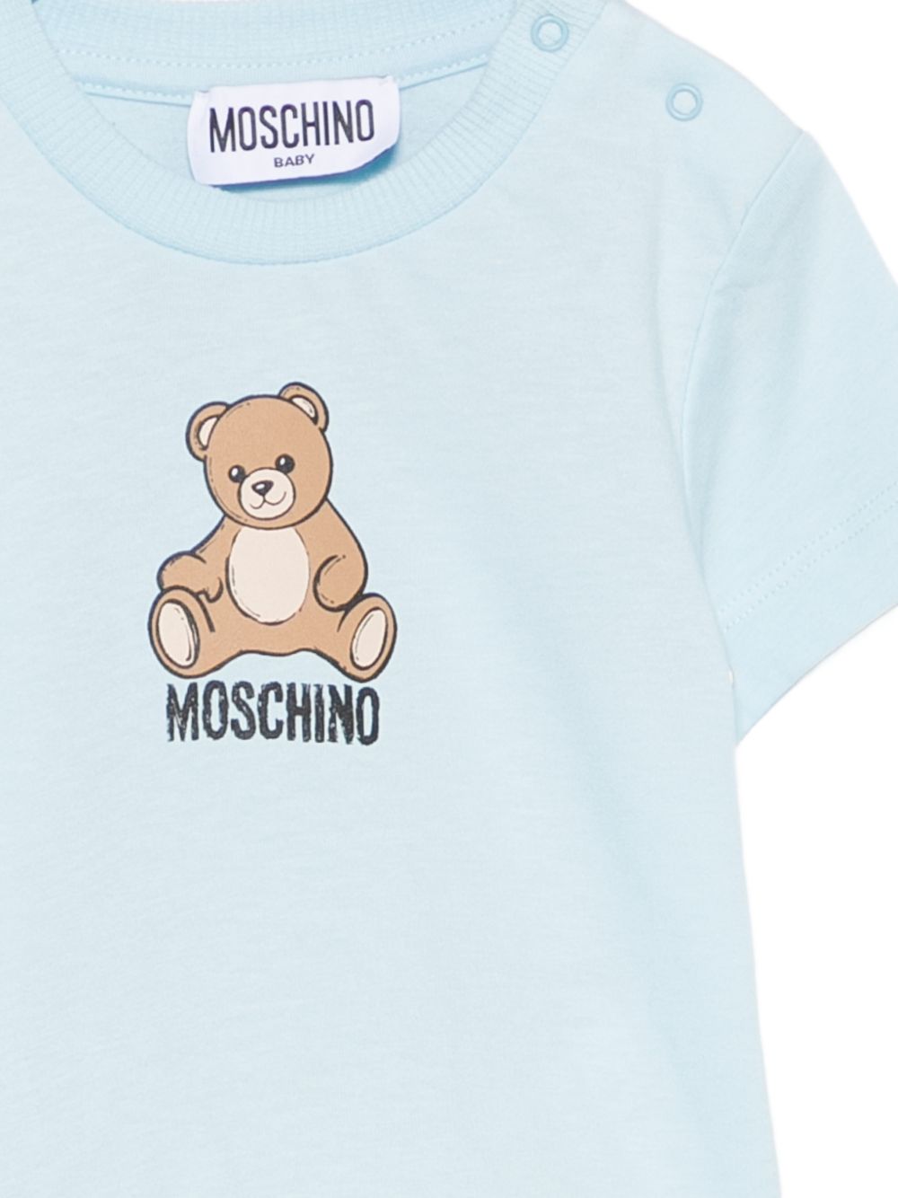 T-shirt per neonato Moschino Kids azzurra con motivo Teddy Bear M9M047LAA10 40304 MOSCHINO KIDS