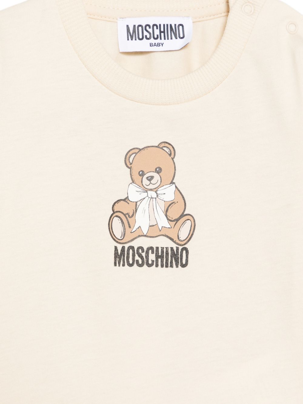 T-shirt per neonati Moschino Kids beige con stampa Teddy con dettaglio fiocco MTO014LAA10 20404 MOSCHINO KIDS