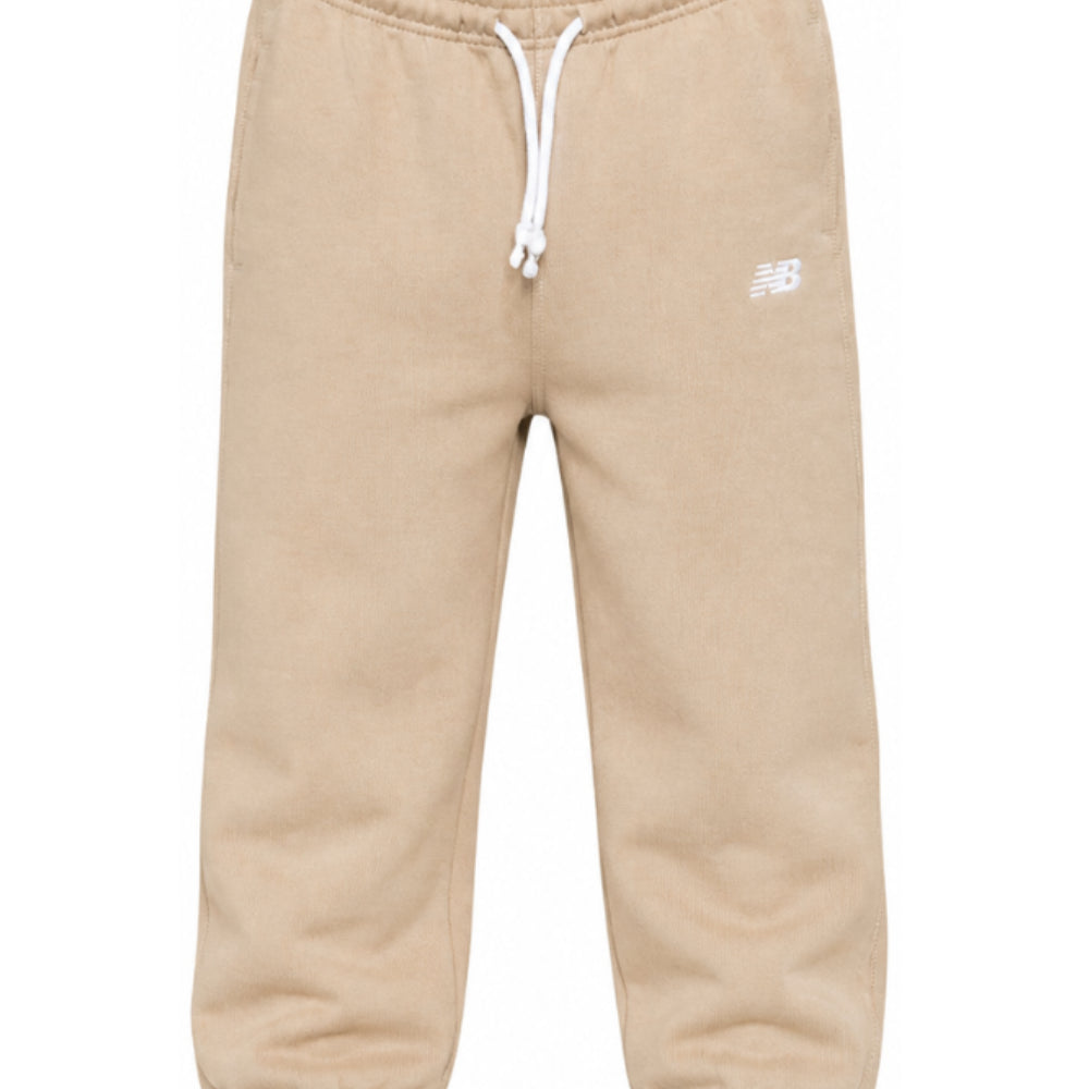 Pantaloni sportivi New Balance Kids beige con logo stampato sul davanti LAKB0060 SOT NEW BALANCE KIDS