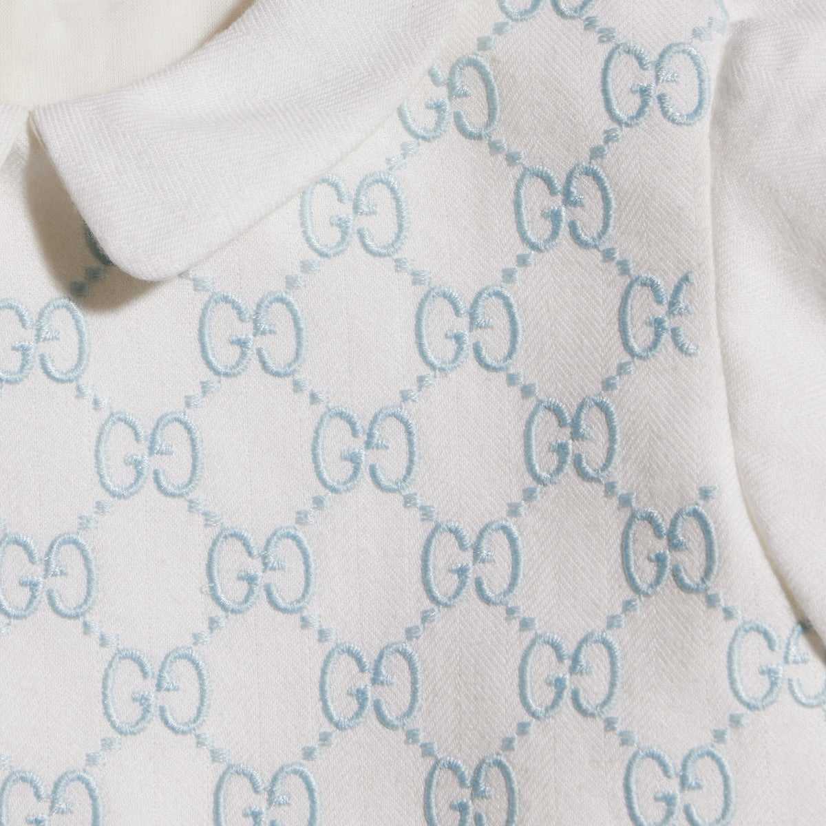 Tutina per neonato Gucci Kids bianca con ricamo GG 866487ZAI9G 9128 GUCCI KIDS