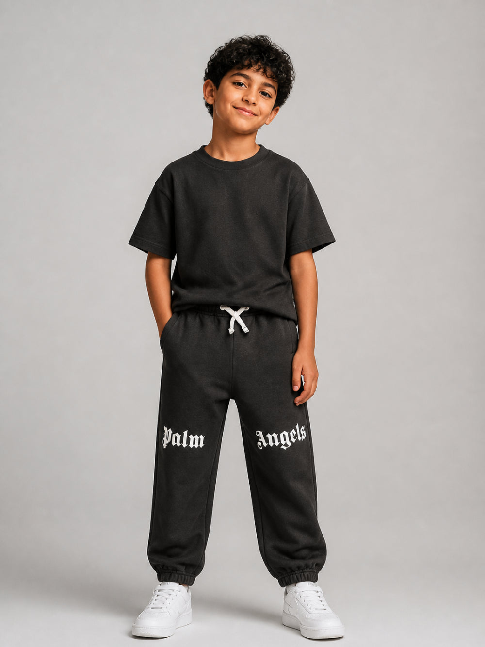 Pantatuta per bambino Palm Angels Kids nero con stampa logo sul davanti F6PAJBFP016 110 PALM ANGELS KIDS