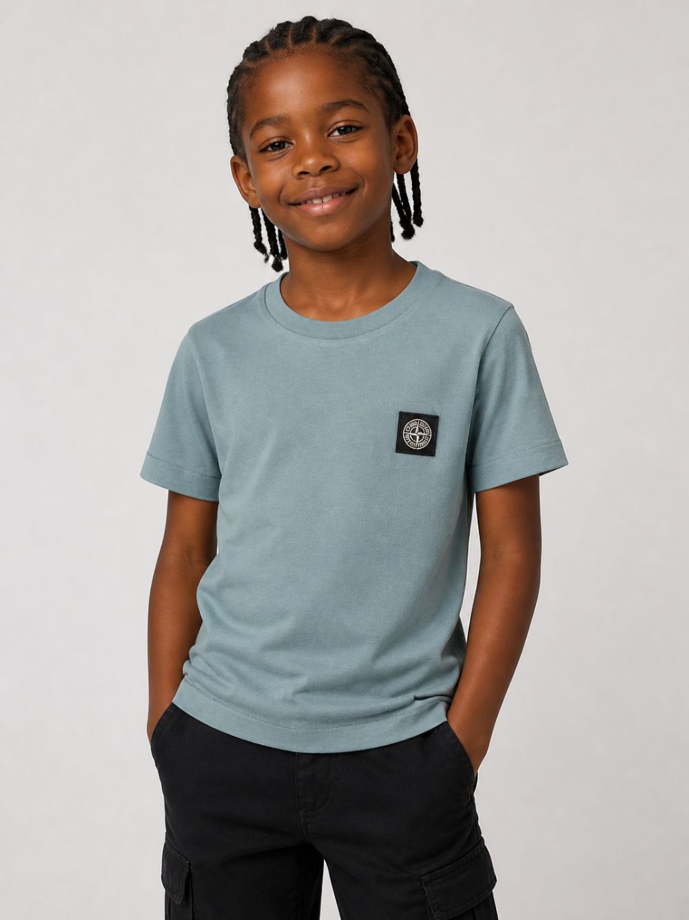 T-shirt per bambino Stone Island Kids azzurro con logo sul davanti L2S162100003S0047 V004B STONE ISLAND KIDS
