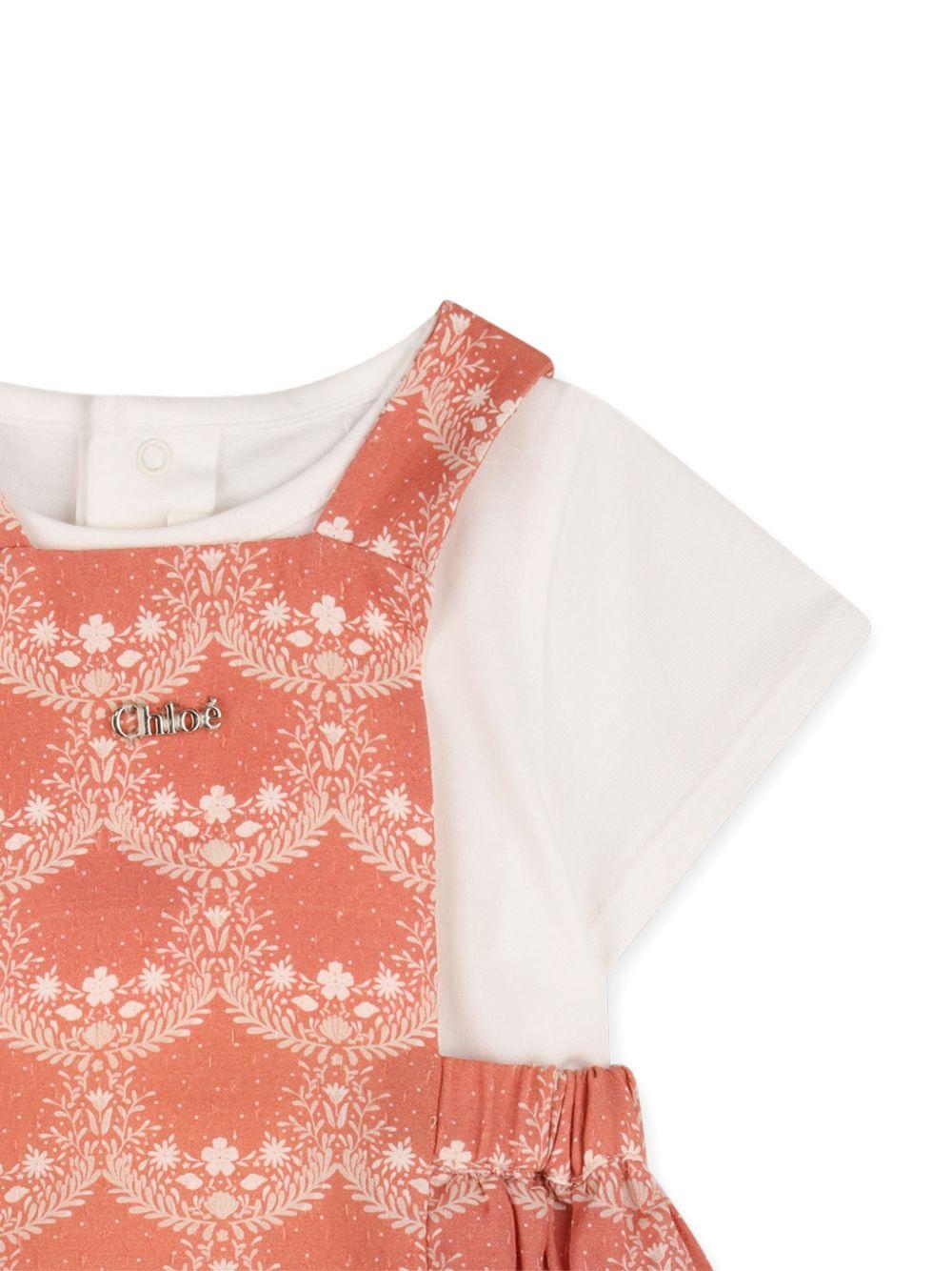 Body per neonata Chloé Kids arancione e bianco a fiori con ruches - Rubino Kids