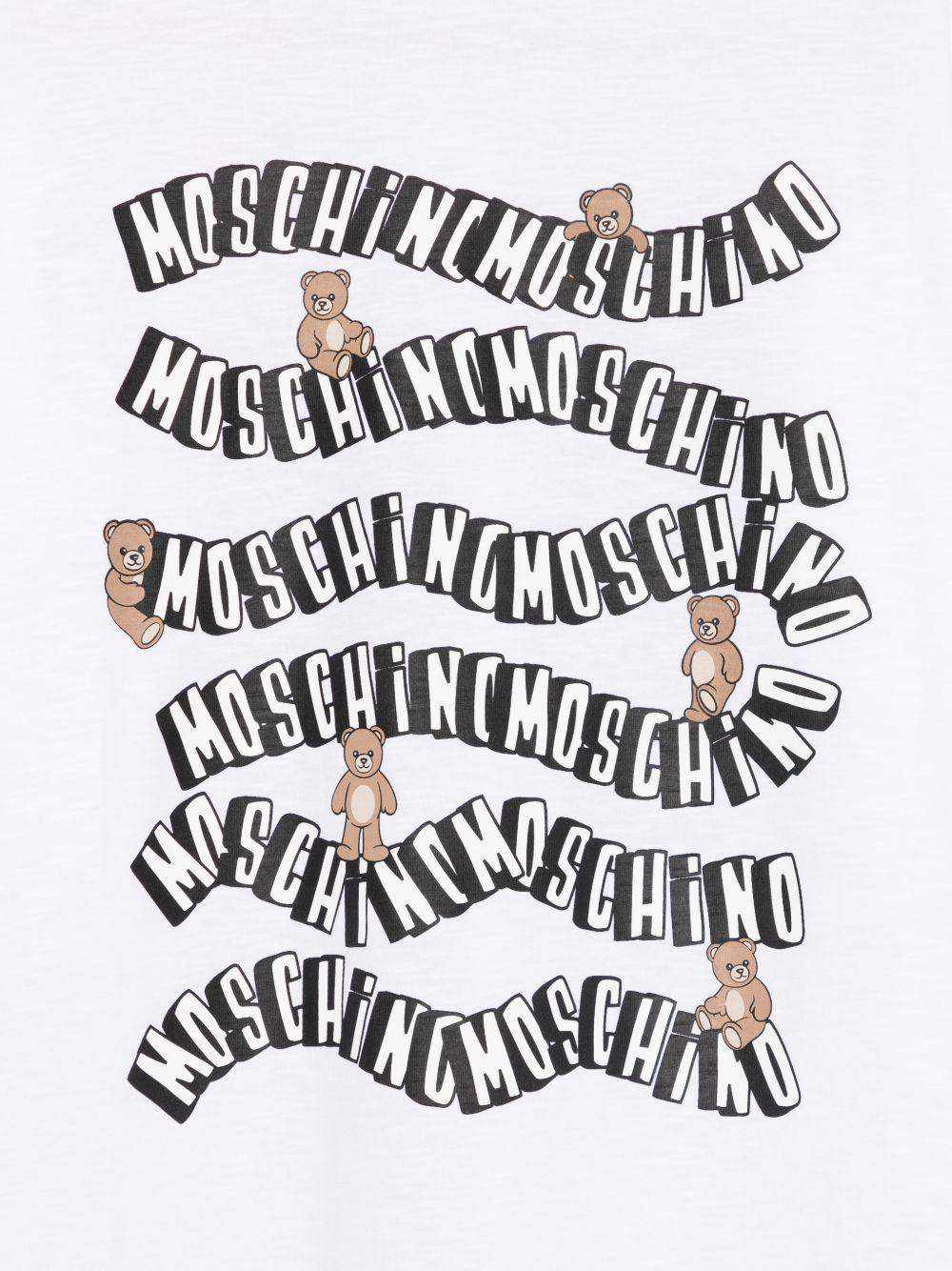 T-shirt per bambini Moschino Kids bianca con stampa grafica sul davanti HXM05GLAA52 10101 MOSCHINO KIDS