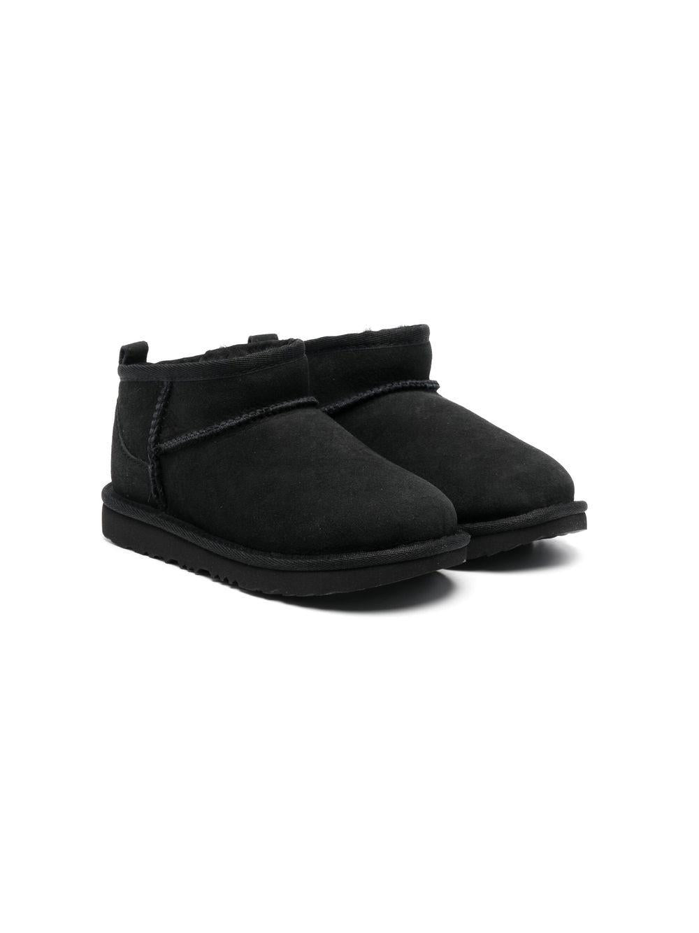 Stivali Ultra Mini per bambina UGG Kids neri con finitura idrorepellente<BR/> 1130750K BLK UGG