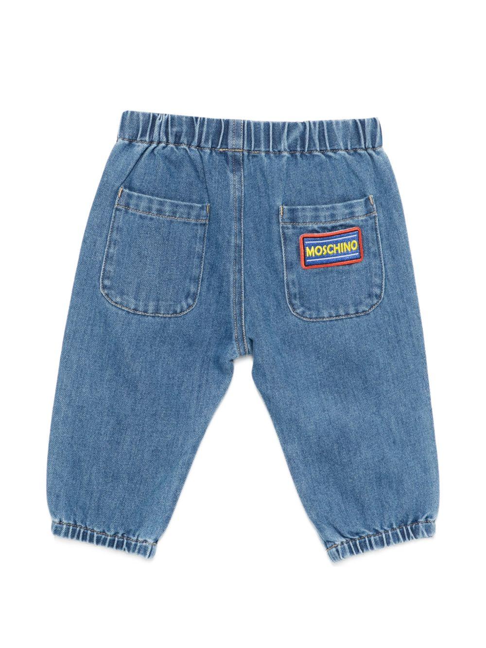 Pantaloni per neonato Moschino Kids denim con toppe ricamate MUP05SL0E34 40646 MOSCHINO KIDS