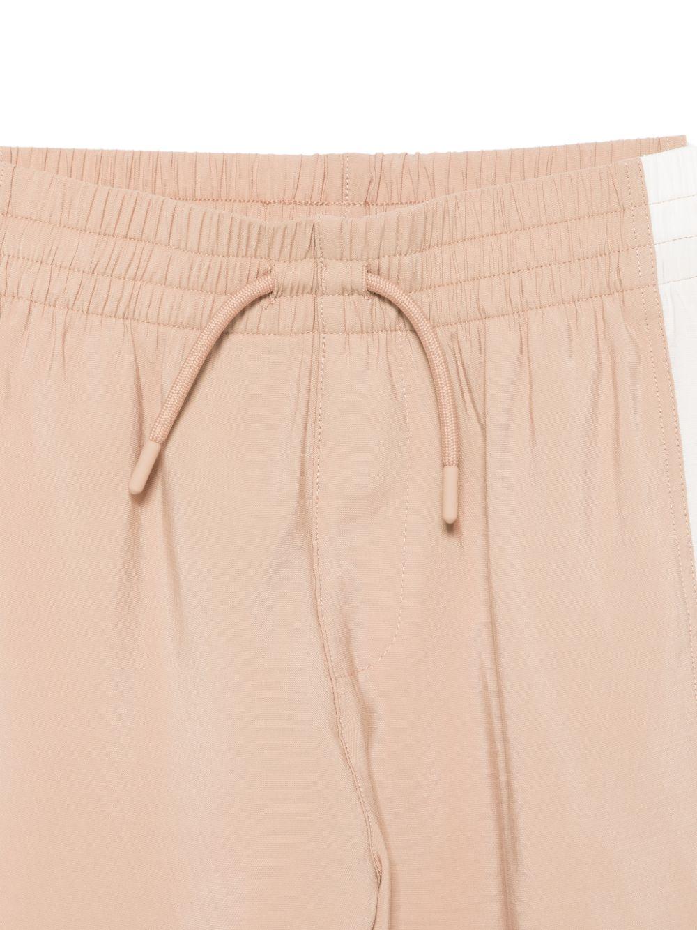 Set t-shirt e shorts per bambino Emporio Armani Kids beige con dettagli a contrasto EB001042 AF20699 M1301 EMPORIO ARMANI KIDS