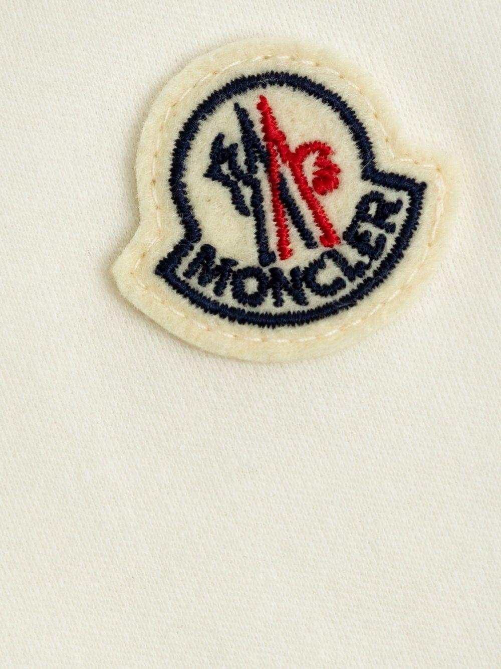 Abito in cotone per neonata Moncler Enfant con dettagli con ruches K19518M000118392E F00 MONCLER ENFANT