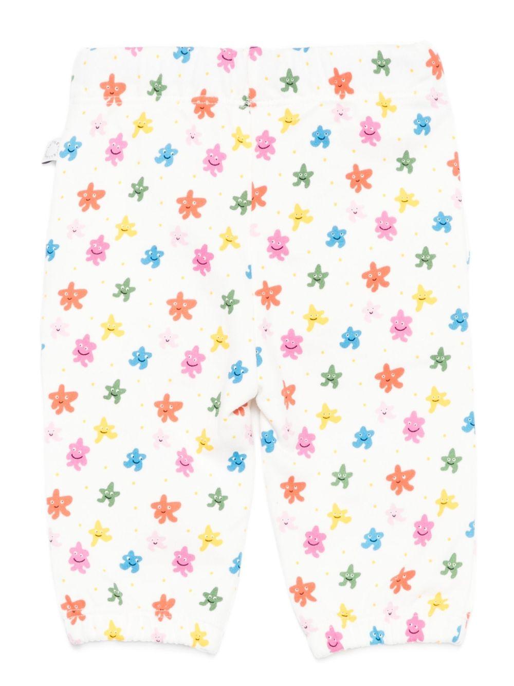 Pantaloni sportivi per neonata Stella McCartney Kids bianco con stelle all-over TX6050 Z3209 101MC STELLA McCARTNEY KIDS