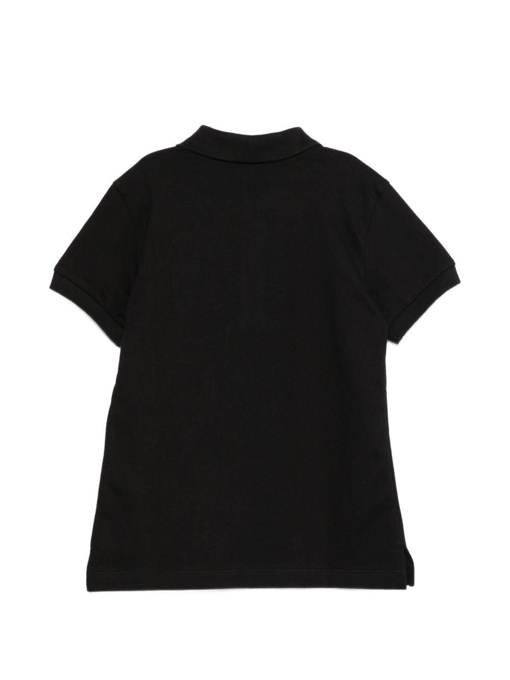 Polo per bambino Moschino Kids nero con targhetta logo HTM03YLFA09 60100 MOSCHINO KIDS