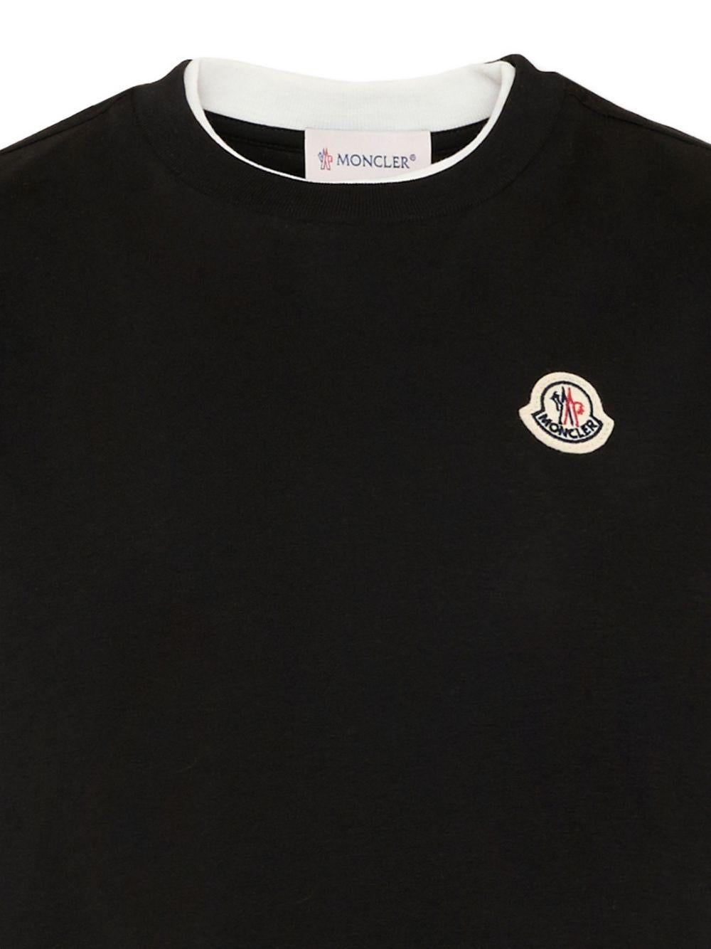 T-shirt per bambino Moncler Enfant nera con dettaglio logo L29548C0000889AFV 999 MONCLER KIDS