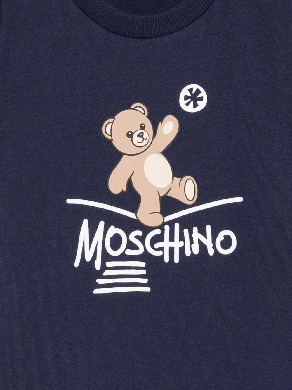 T-shirt per bambini Moschino Kids blu con motivo Teddy Bear HUM05XLAA20 40016 MOSCHINO KIDS