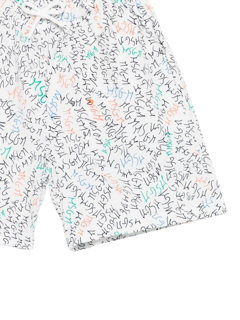 Shorts per bambino MSGM Kids bianchi con stampa logo all-over S6MSJBBE234 001 MSGM KIDS