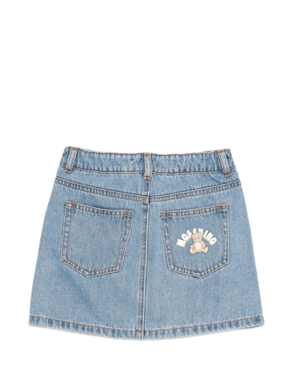 Gonna per bambina Moschino Kids in denim con stampa logo sul retro HDJ044L0E35 40183 MOSCHINO KIDS