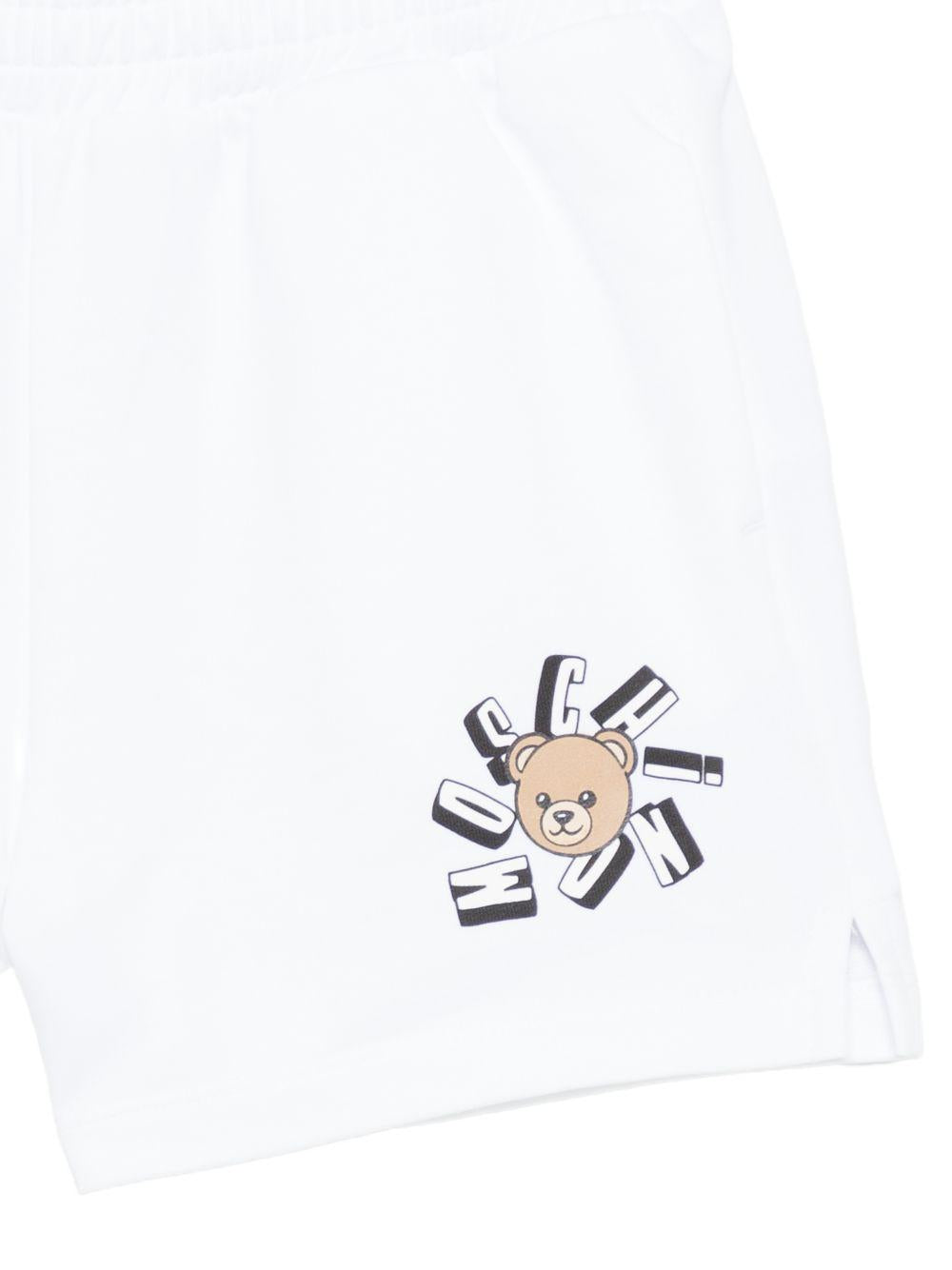 Shorts per bambini Moschino Kids bianchi con stampa Teddy Bear HDQ025LCA19 10101 MOSCHINO KIDS