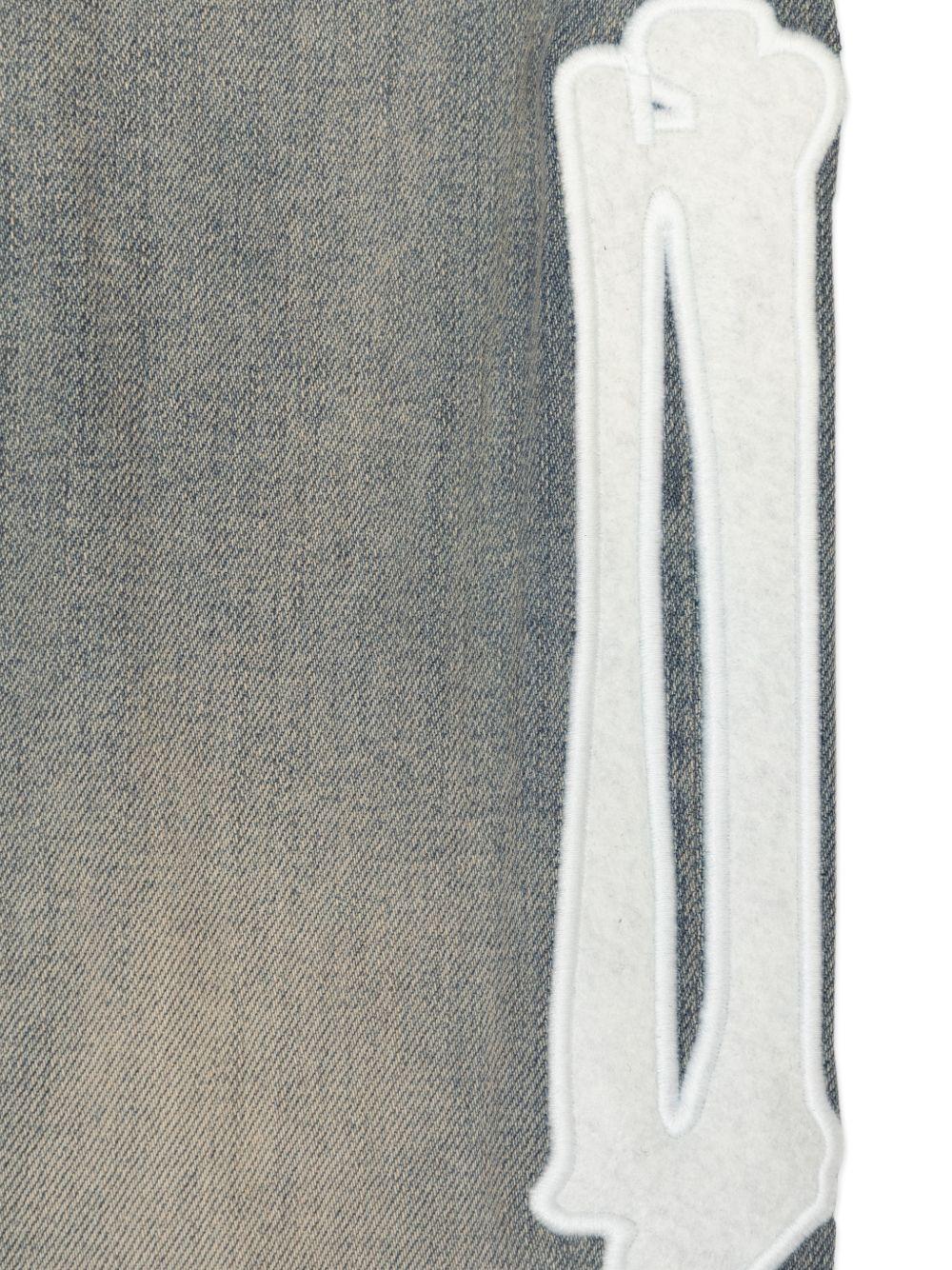 Jeans per bambino Amiri Kids denim con applicazione con ossa ACBMPA1006 406 AMIRI KIDS