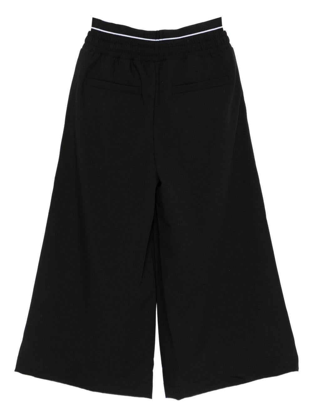 Pantaloni per bambina MSGM Kids neri con dettaglio logo F5MSJUPA275 110 MSGM KIDS