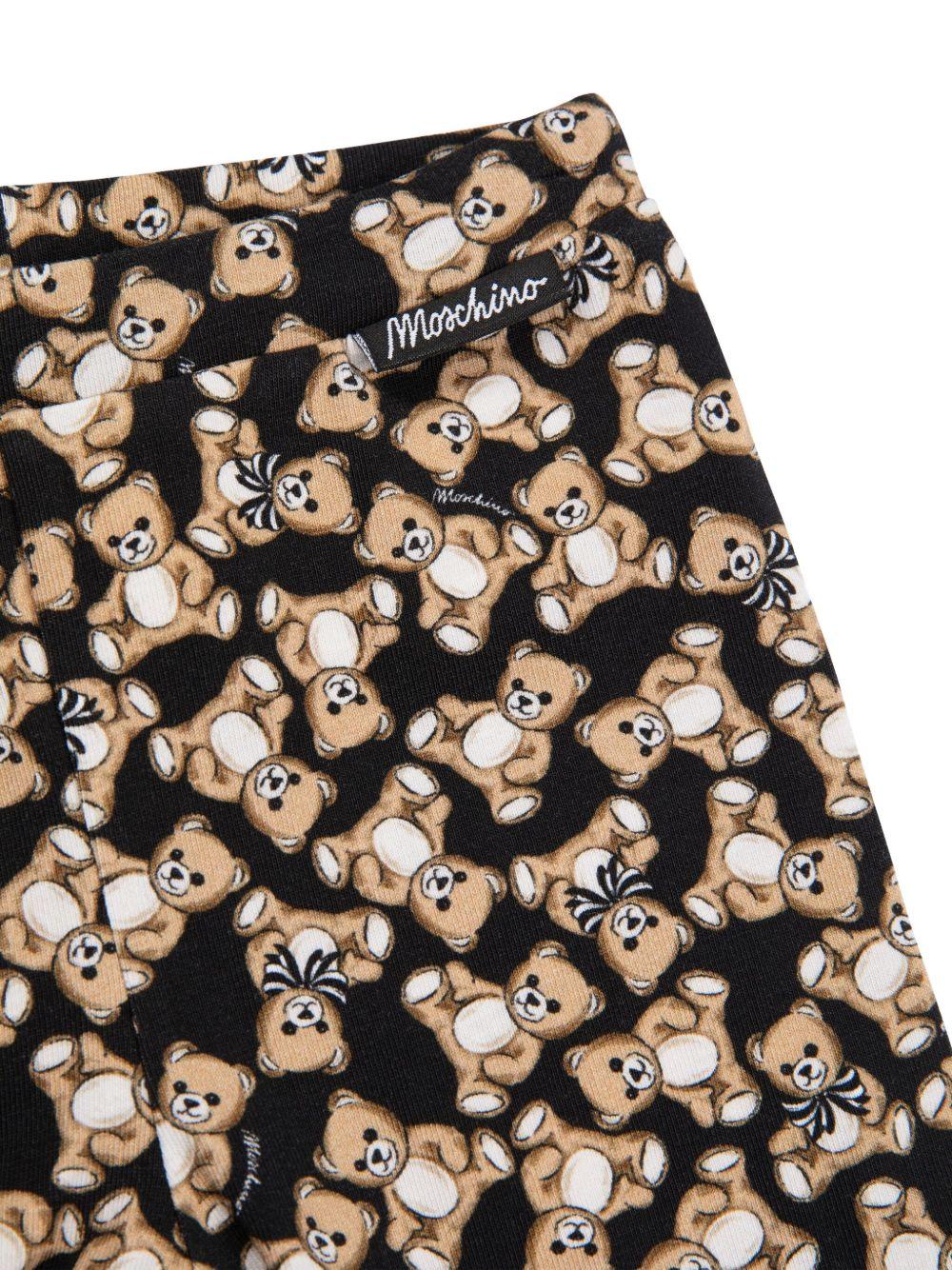 Leggins per neonata Moschino Kids neri con stampa Teddy Bear all-over MHP032LBB8E 84923 MOSCHINO KIDS