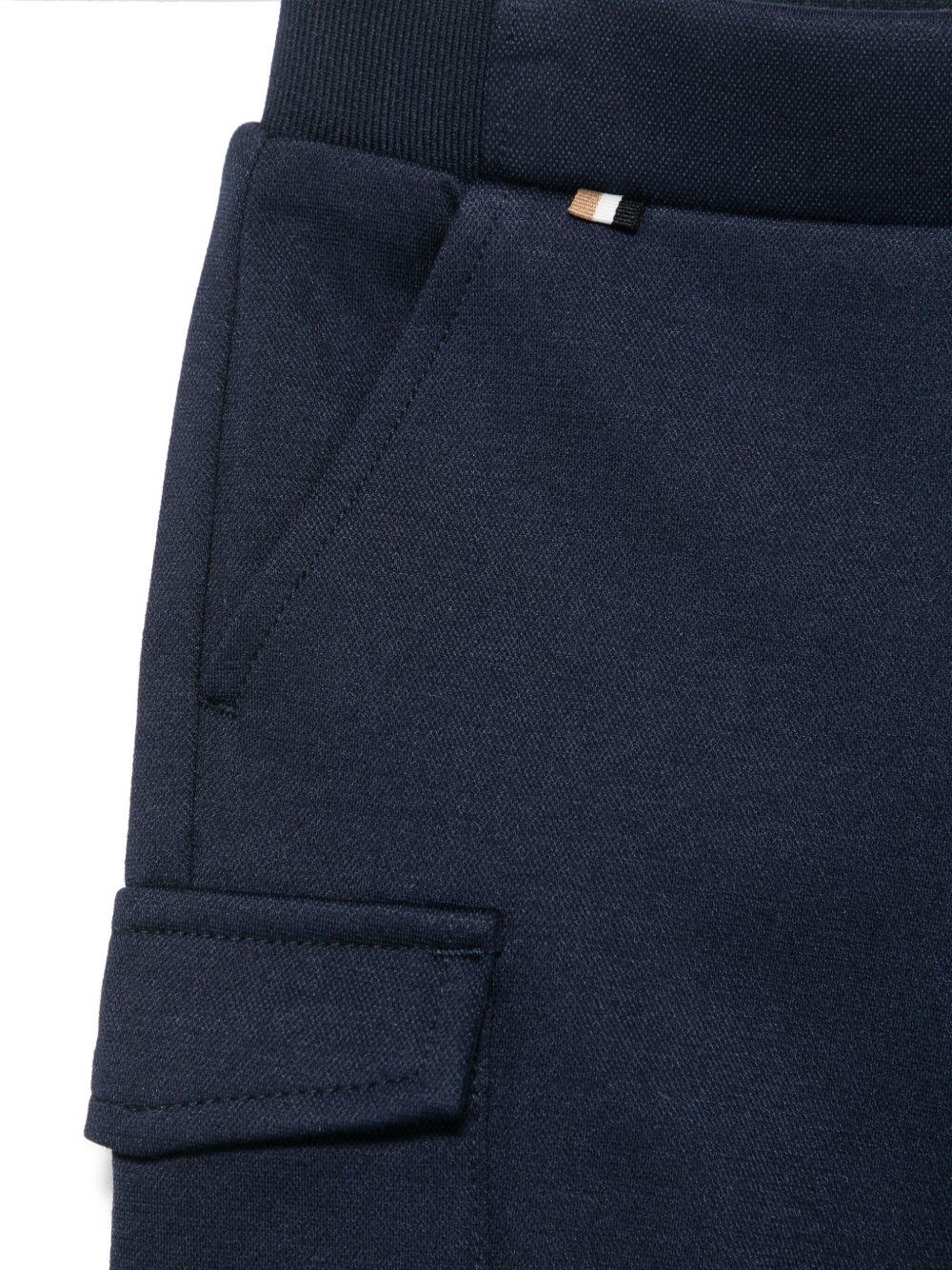 Pantaloni sportivi affusolati per neonato BOSS Kidswear blu con due tasche laterali J52076 849 BOSS KIDS