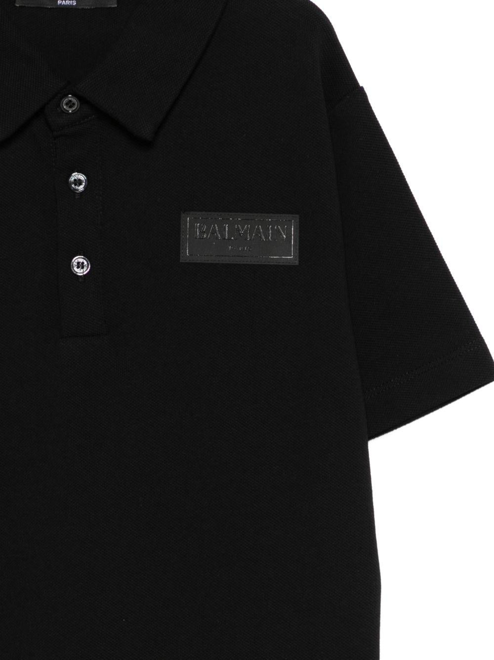Polo per bambino Balmain Kids nera con dettaglio logo applicato BY8Q01 Z3658 930NE BALMAIN KIDS