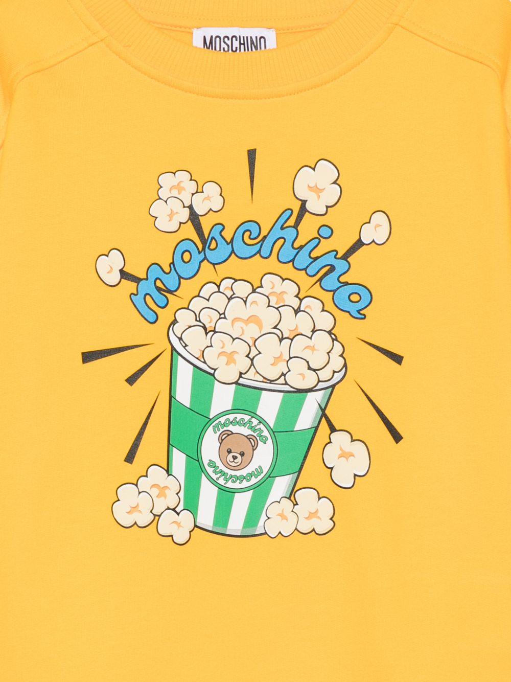 Felpa per bambini Moschino Kids gialla con stampa grafica HNF099LCA94 51140 MOSCHINO KIDS