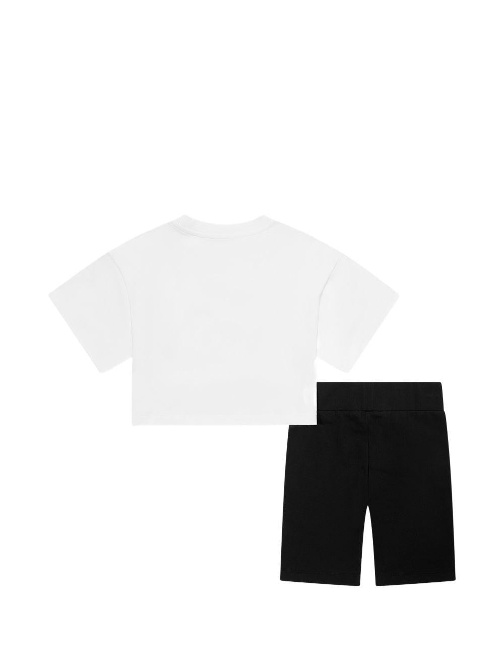 Set t-shirt e shorts per bambina Moschino Kids bianco e nero con motivo Teddy Bear HAG01HLBA00 80359 MOSCHINO KIDS