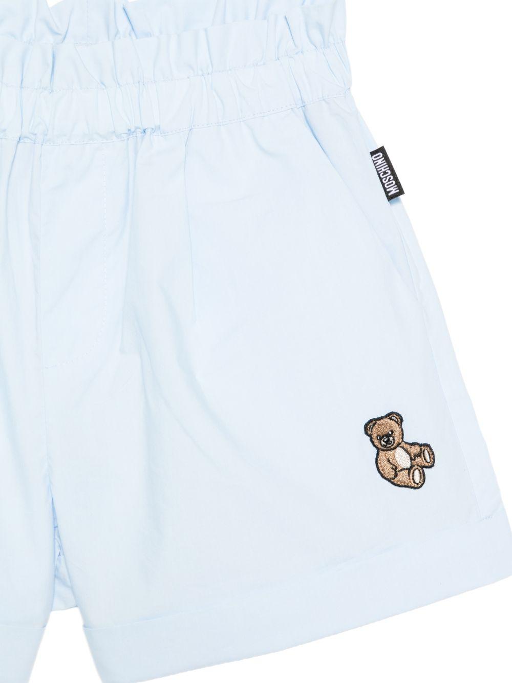 Shorts per bambina Moschino Kids azzurro con vita elasticizzata HDQ01YLLA10 40543 MOSCHINO KIDS