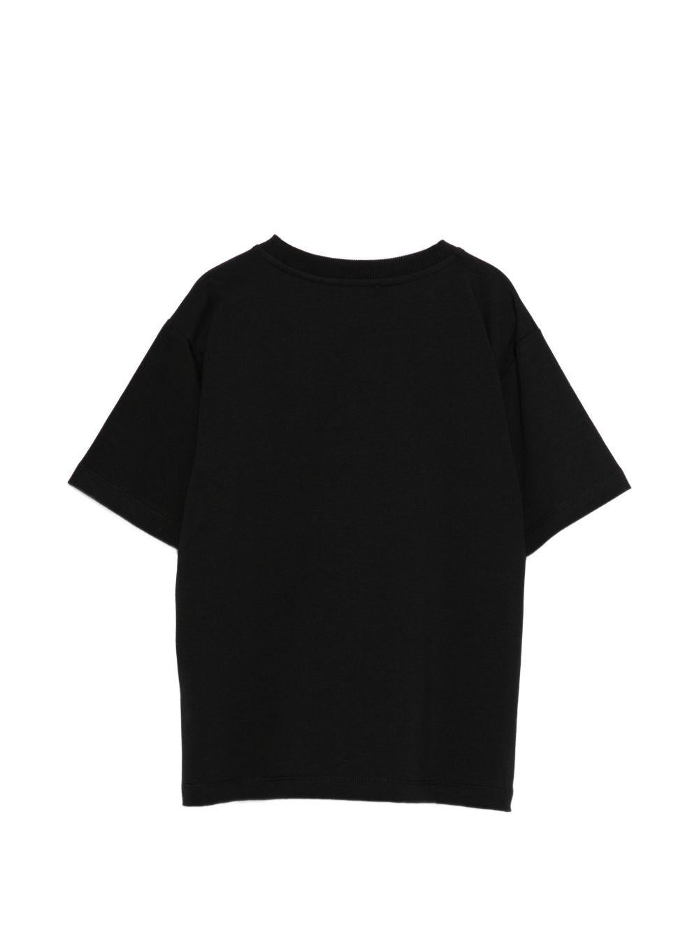 T-shirt per bambina Moschino Kids nera con logo sul davanti HDM074LBA00 60100 MOSCHINO KIDS