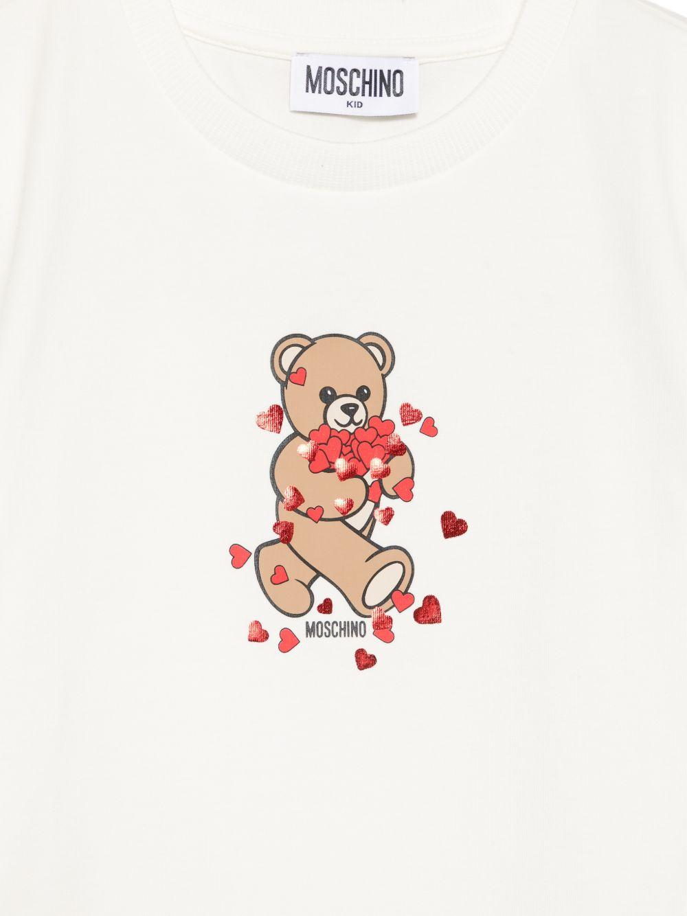 T-shirt per bambina Moschino Kids bianca con stampa grafica HIM06KLBA11 10063 MOSCHINO KIDS