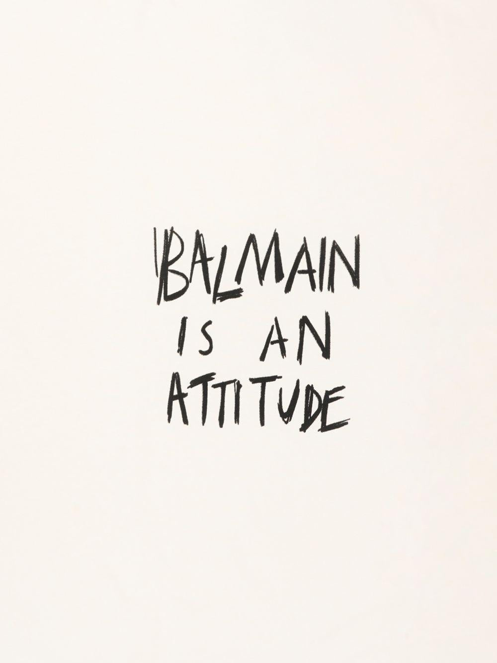 Coperta per neonati Balmain Kids bianca con scritta "Balmain is an attitude" sul davanti BZ0310 Z3672 102NE BALMAIN KIDS