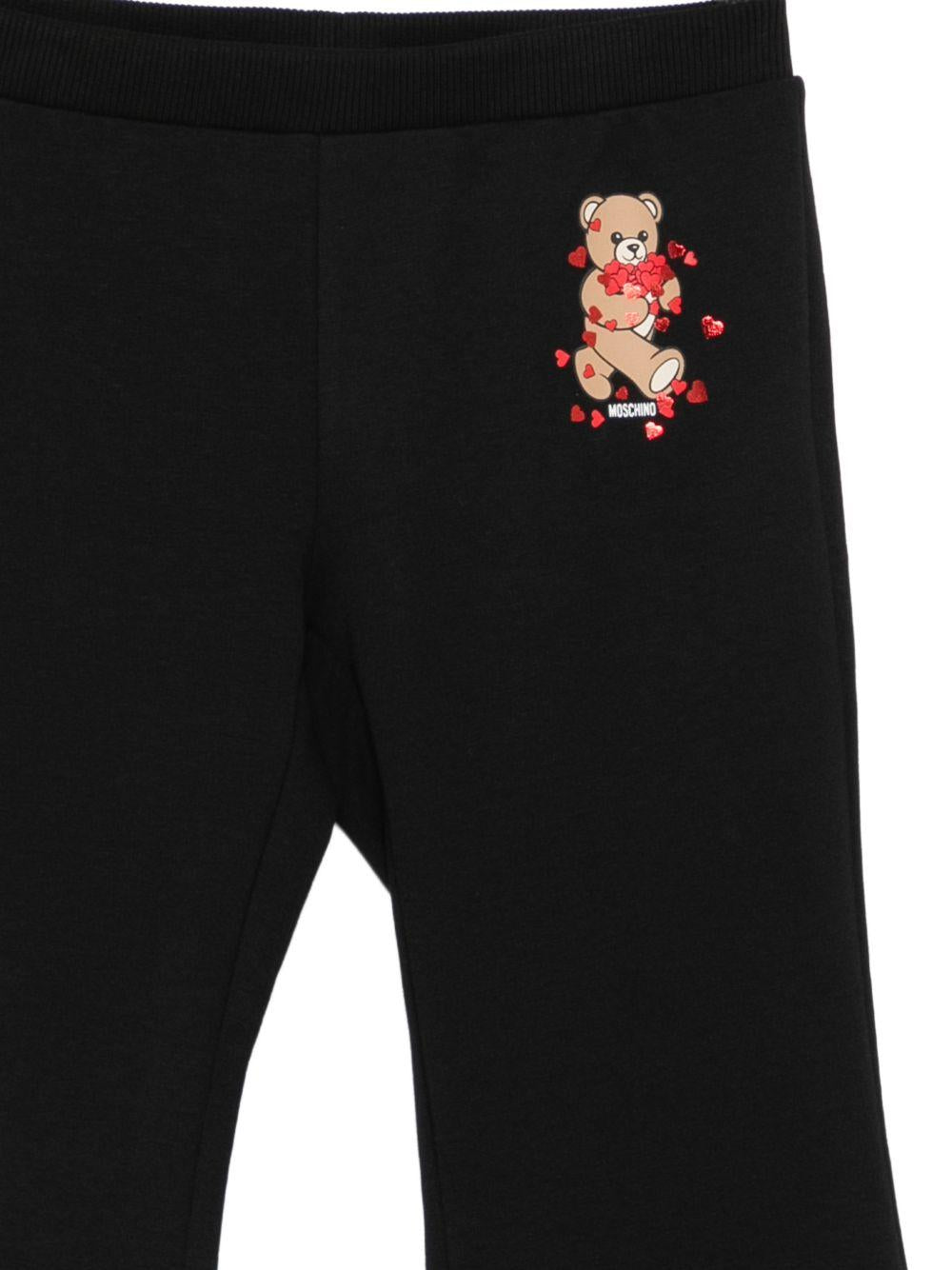 Pantaloni per bambina Moschino Kids neri con stampa Teddy Bear HEP050LDA63 60100 MOSCHINO KIDS