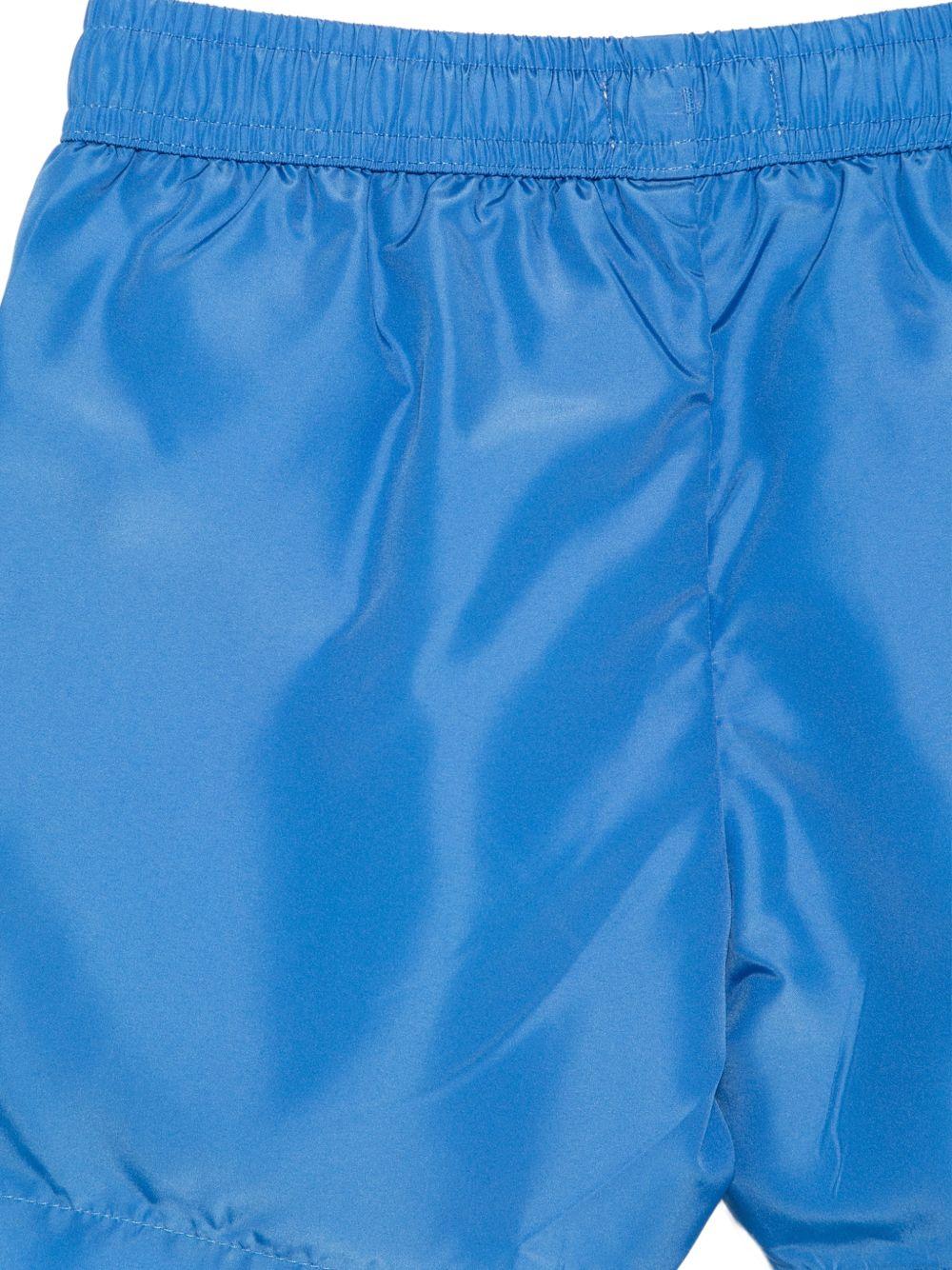 Costume da bagno per bambino Moschino Kids azzurro con stampa logo HUL01LLKA02 40630 MOSCHINO KIDS