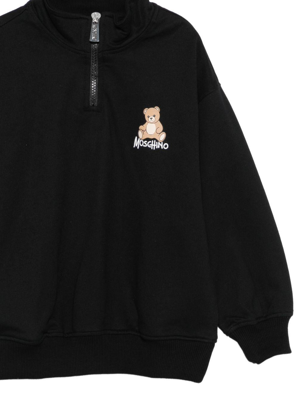 Felpa per bambino Moschino Kids nera con mezza zip HUF0A0LCA94 60100 MOSCHINO KIDS