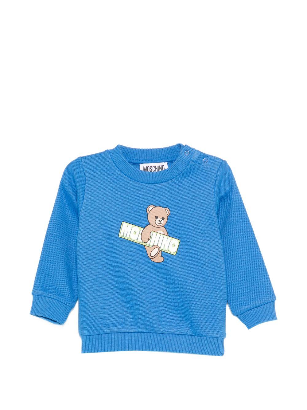 Felpa per neonato Moschino Kids azzurra con Teddy Bear e logo sul davanti MWF060LCA90 40630 MOSCHINO KIDS