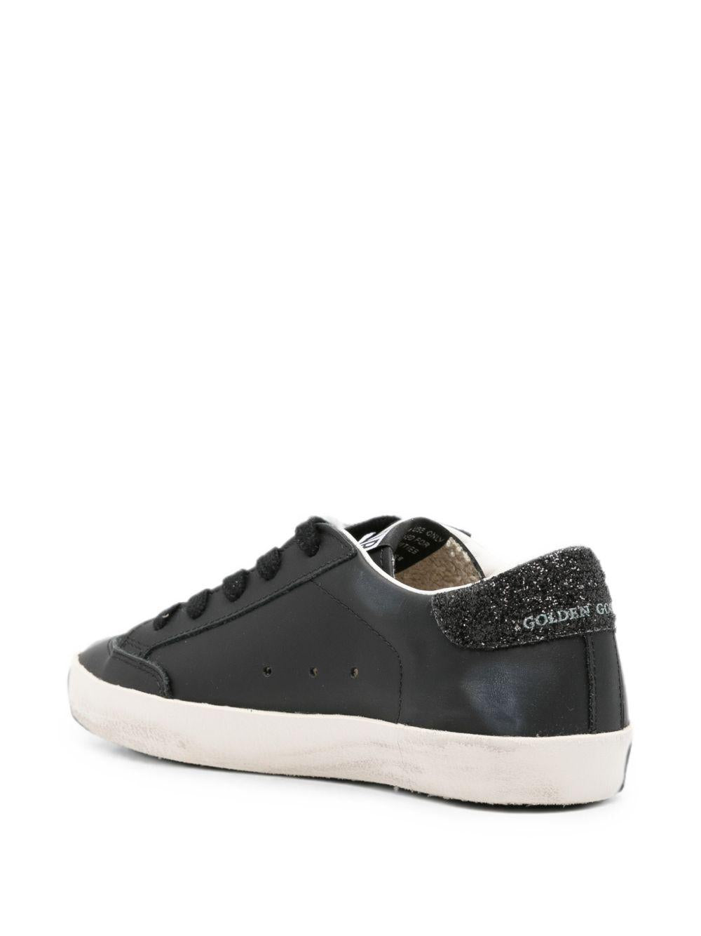 Sneakers per bambina Goolden Goose Kids nera con stella glitterata<BR/> F00107F008661 90100 GOLDEN GOOSE KIDS
