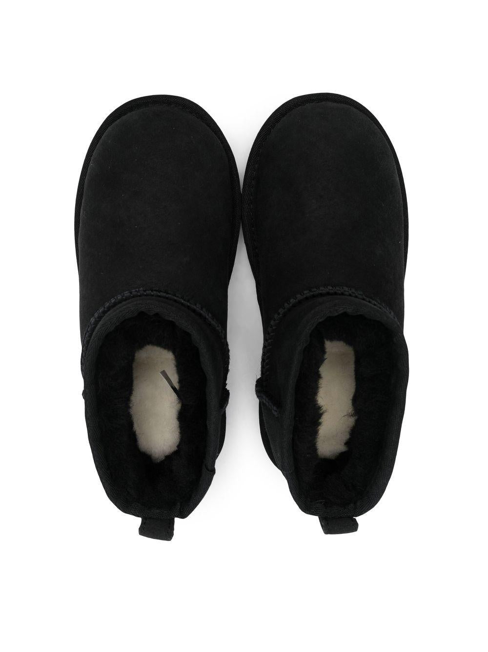 Stivali Ultra Mini per bambina UGG Kids neri con finitura idrorepellente<BR/> 1130750K BLK UGG