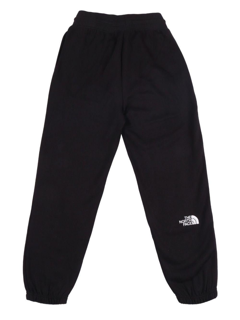 Pantaloni sportivi per bambino The North Face Kids neri con logo sul davanti NF0A8GR6 JK31 THE NORTH FACE KIDS