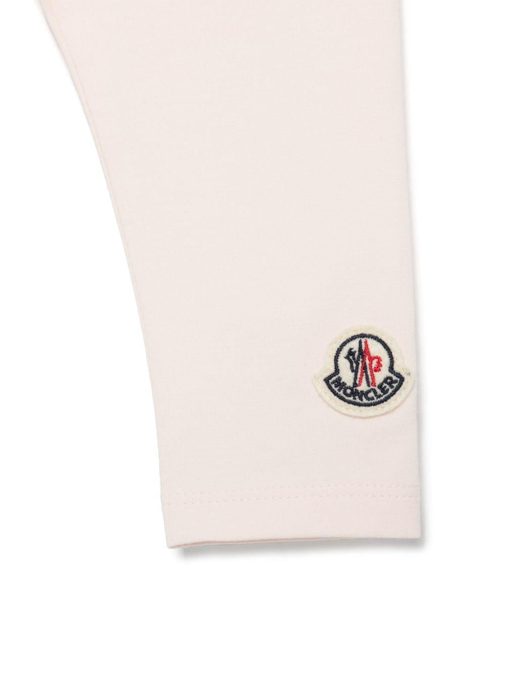 Leggings per neonata Moncler Enfant rosa con applicazione logo sulla gamba K19518H0000289AUM 529 MONCLER ENFANT