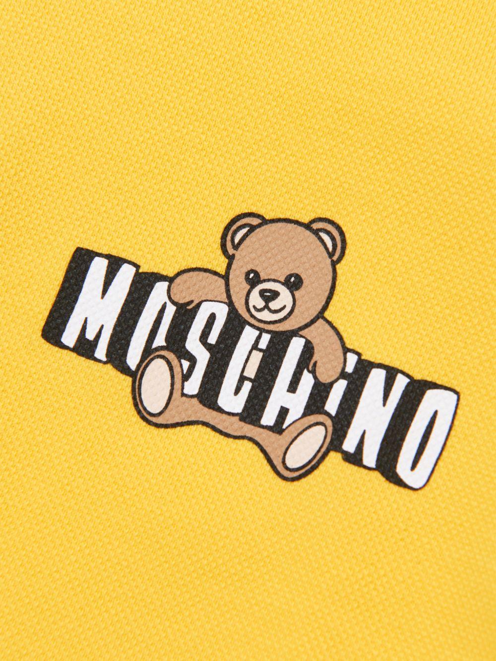 Polo da bambino Moschino kids giallo con stampa orsetto HSM03YLFA09 50577 MOSCHINO KIDS