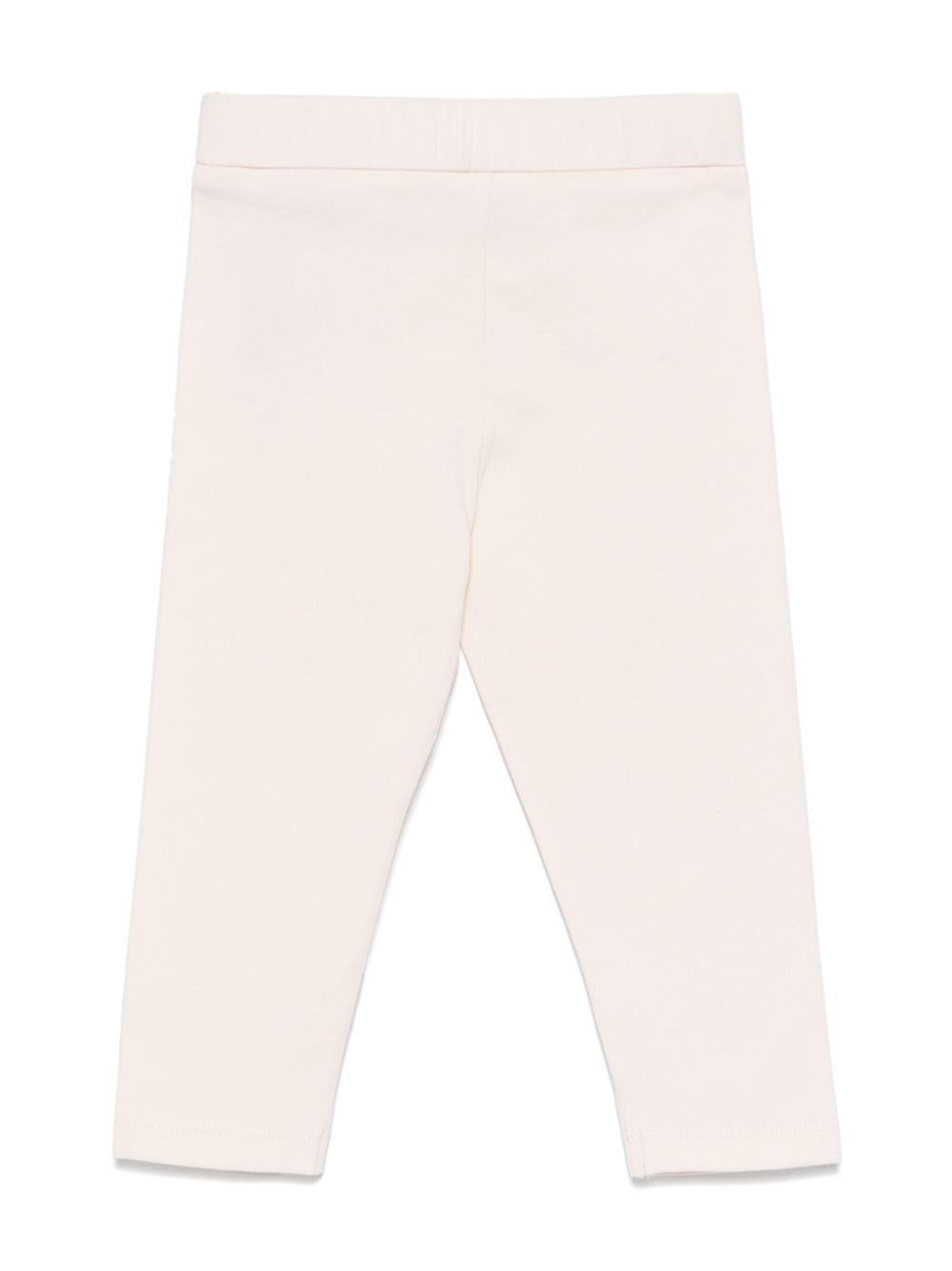 Leggings per neonata Moncler Enfant rosa con applicazione logo sulla gamba K19518H0000289AUM 529 MONCLER KIDS