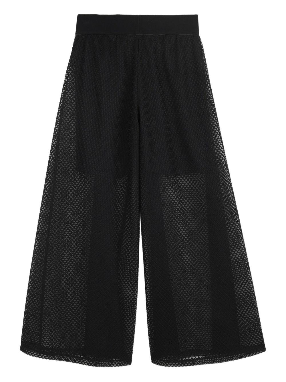 Pantaloni per bambina DKNY Kids neri con placca logo D62580 09B DKNY