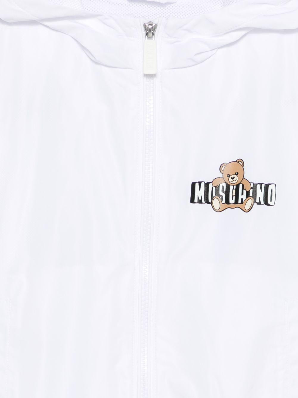 Giubbino per bambini Moschino Kids bianca con stampa Teddy Bear sul davanti HUS05KL3A39 10101 MOSCHINO KIDS
