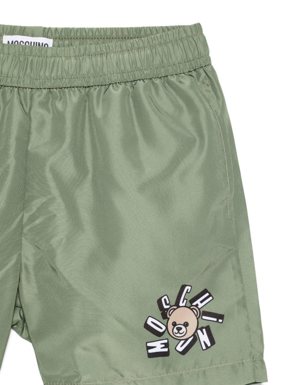 Costume da bagno per bambino Moschino Kids verde con stampa logo HUL01LLKA02 30037 MOSCHINO KIDS
