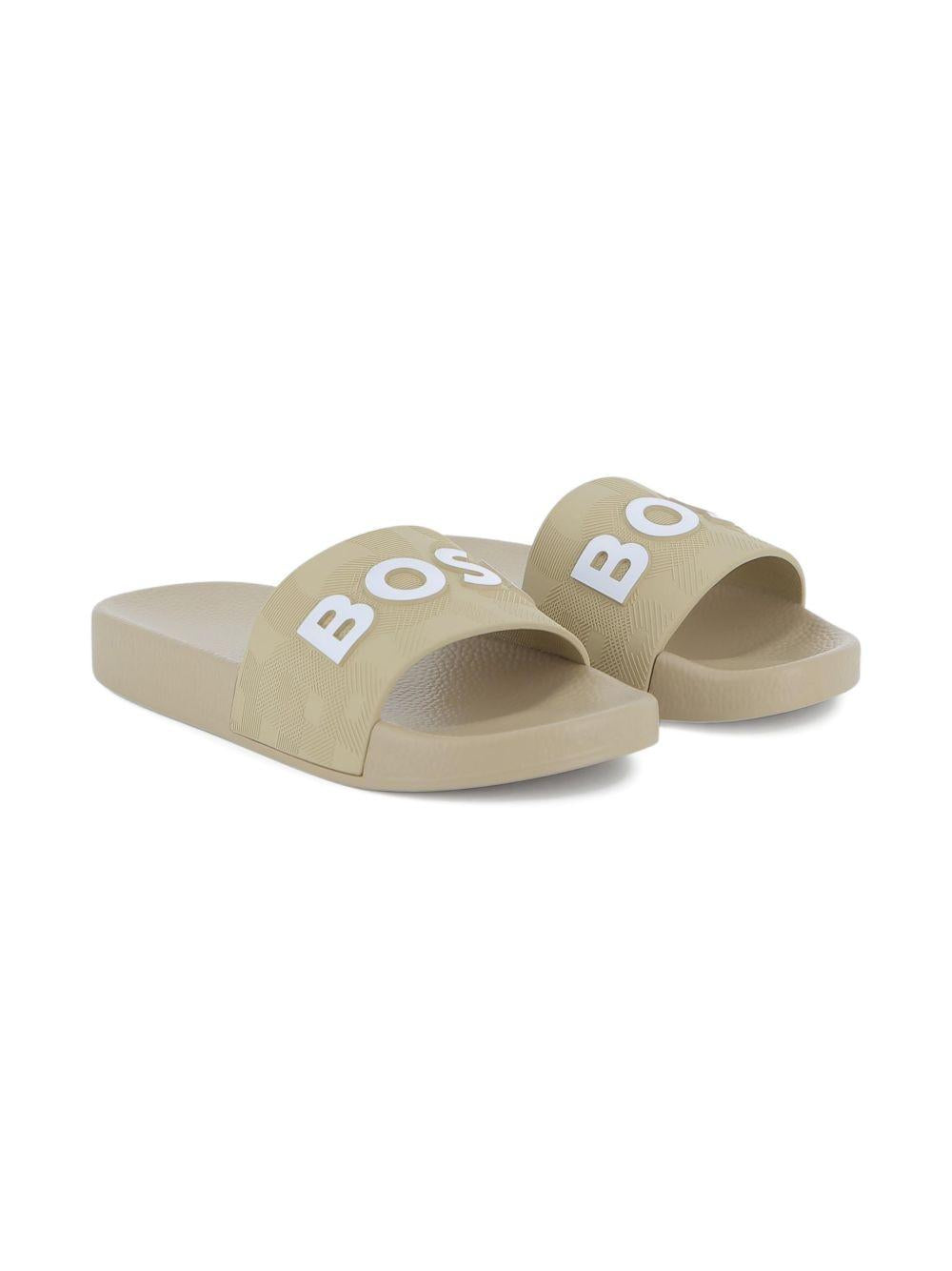 Ciabatte per bambino Boss Kids beige con dettaglio con logo J52799 249 BOSS KIDS