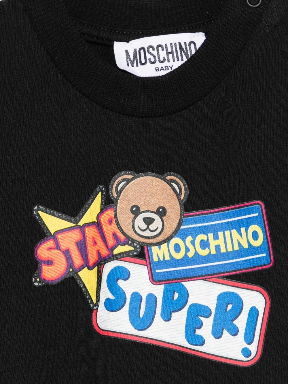 T-shirt per neonato Moschino Kids nera con stampa grafica MUM04LLAA24 60100 MOSCHINO KIDS
